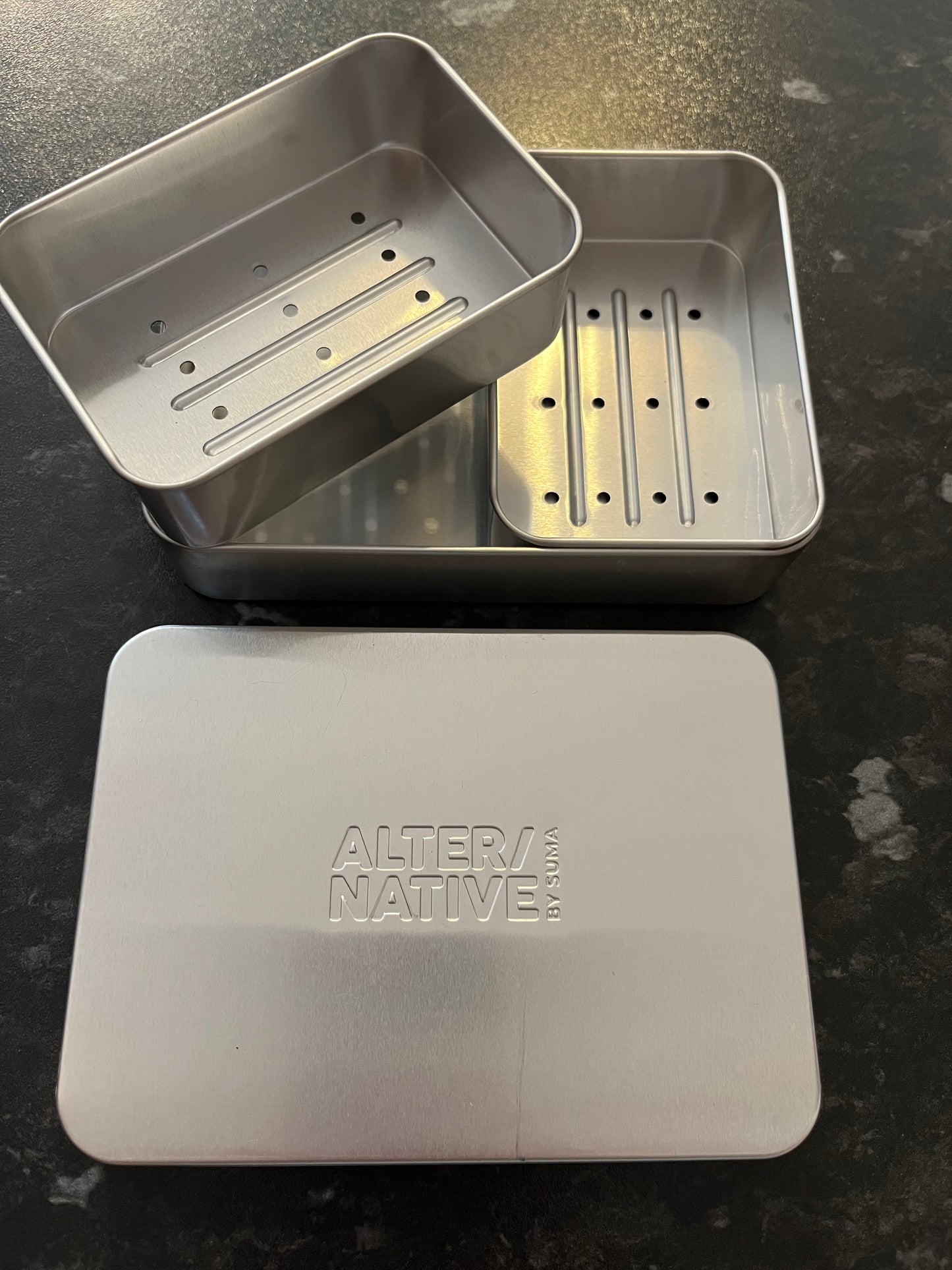 The inside of Alter/Native’s double soap tin.