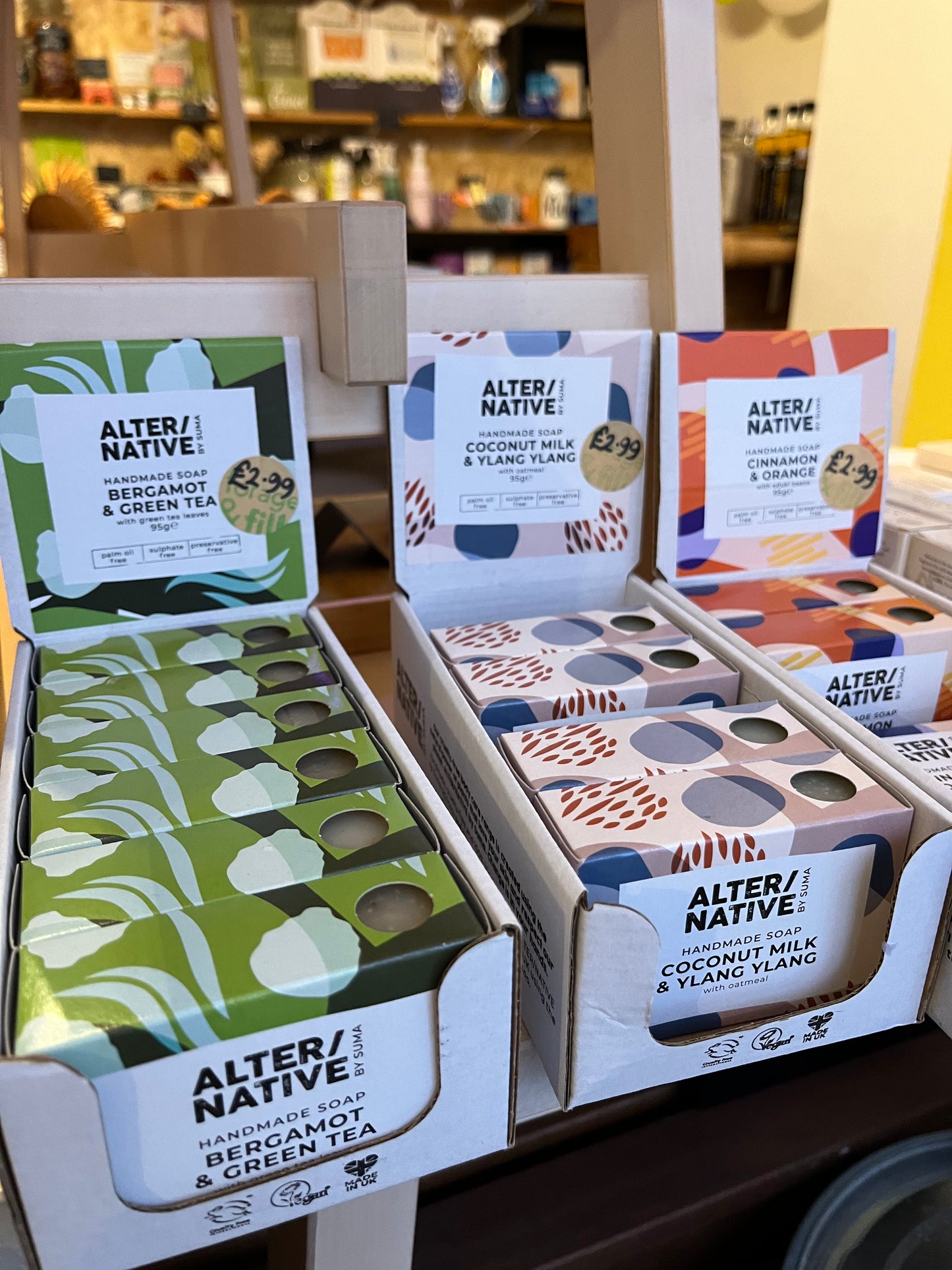 Three trays of Alter/Native soap bars, Bergamot and Green Tea, Coconut Milk and Ylang Ylang, and Cinnamon and Orange.