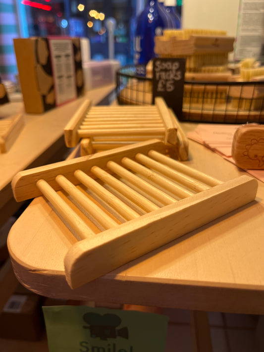 Bamboo Soap Racks with rounded corners and round slats for extra drainage on a shelf in a zero waste shop.