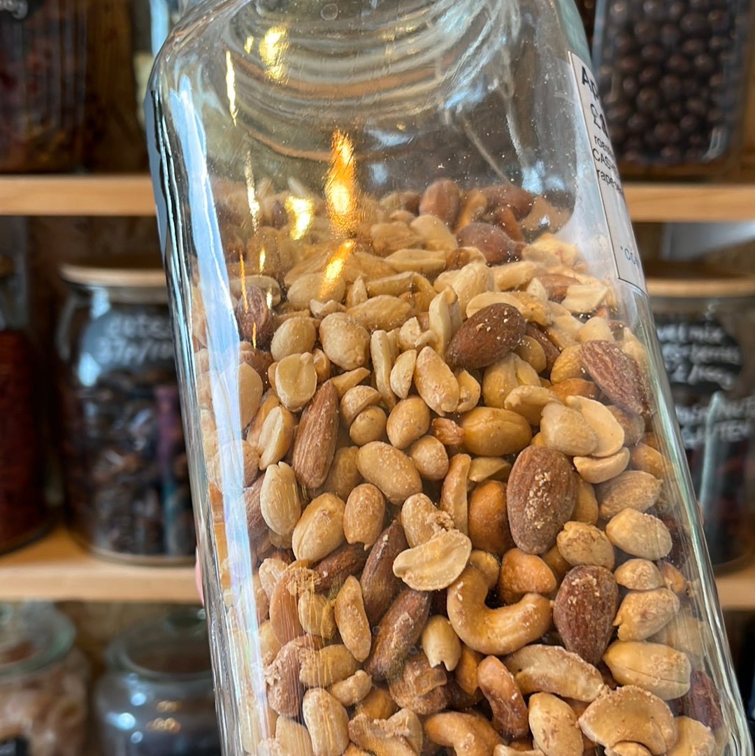 Applewood Smoked Nuts in a glass container.