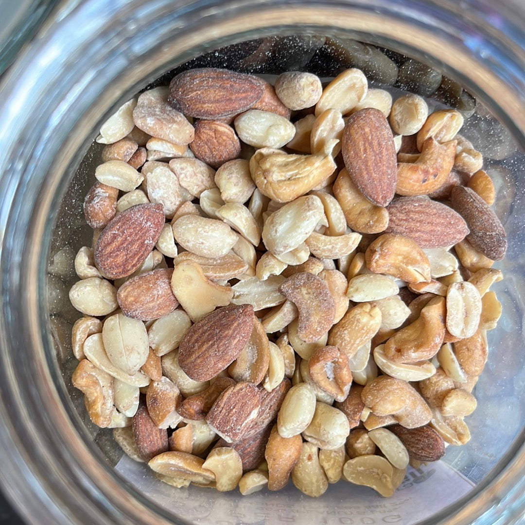Applewood Smoked Nuts in a glass container.